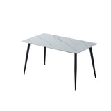 Tavolo 140x80 con top in ceramica effetto marmo grigio opaco e gambe in metallo nero.