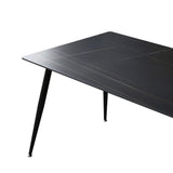 Tavolo 140x80 con top in ceramica effetto marmo grigio opaco e gambe in metallo nero.